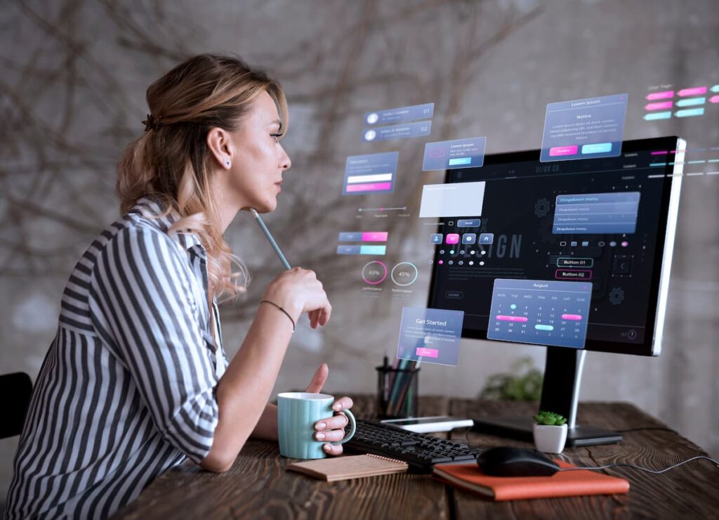 Woman analyzing futuristic UI on screen, representing data modernization challenges in digital interface design.