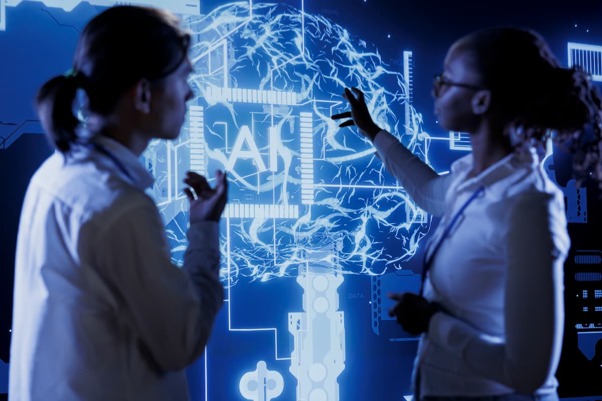 Two professionals discussing a digital brain interface, illustrating the impact of AI in data modernization and analytics.